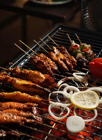 Riverside barbecue setup at Riveria by V Stays with scenic views